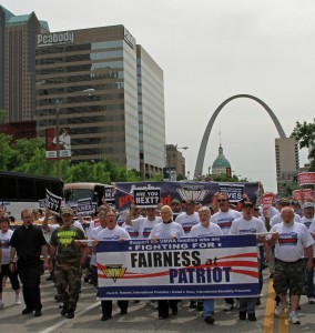 MARCHING FOR JUSTICE: Thousands of active and retired miners and supporting union members marched through the streets of downtown St. Louis May 21 to demand fairness in the bankruptcy proceedings of Peabody Energy spinoff Patriot Coal. Labor Tribune photo 