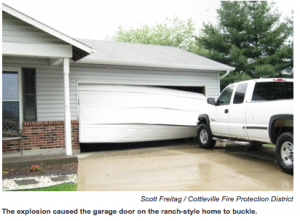 ONE HELLAVA EXPLOSION: The basement explosion at the St. Peters home where Huddy Painting was painting the basement floor was so strong it also buckled the garage door on the ranch-style home. Cottleville Fire Protection District photo from screen capture
