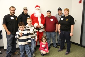 Santa is joined by his “elves” from the Painters District Council 2 who helped make Christmas a lot brighter for 27 children at Rankin Jordan Pediatric Hospital over the holidays. Painters Young Lions (from left), Dave Neels, Steve Gosney, Santa (Matt Neels), Young Lions President Page Lucks, Zach Crites, and Amy Stricker. In front, Jake, Micah and Hannah Lucks who received a first-hand lesson on the joys of giving. – Gary Otten photos