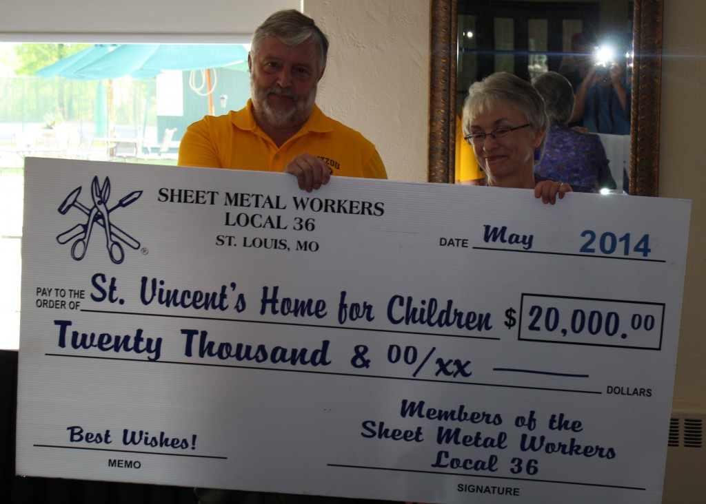 DONATION: Sheet Metal Workers Local 36 President and Business Manager David Zimmermann (left) presents a check for $20,000 to Carla Monroe-Posey, executive director of the St. Vincent’s Home for Children. – Sheet Metal Workers Local 36 photos 