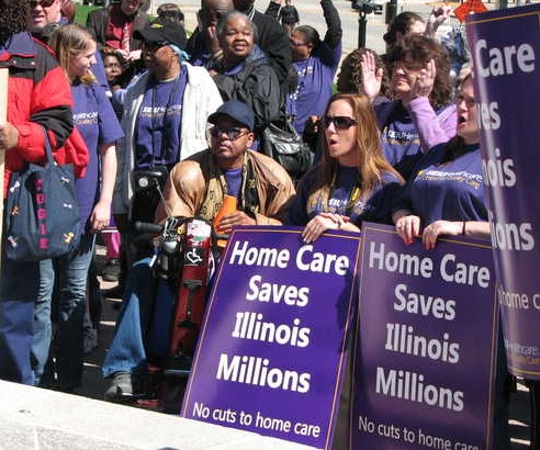 HOME CARE WORKERS reacting earlier this year to the U.S. Supreme Court’s decision to hear argument in Harris v. Quinn. The court ruled Monday to legalize “free riders in cases where states and/or local governments, together with individuals, jointly employ home based care givers. – Daily Kos photo 