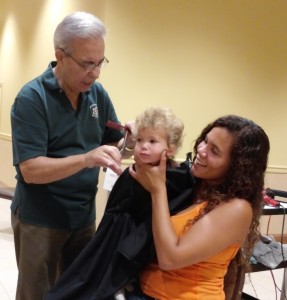 SCHOOL AND A HAIRCUT: Local 110 provided free back-to-school haircuts for its members' children as part of its Eighth Annual Backpack Drive Aug. 9.