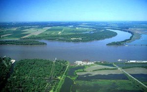 A RIVER RUNS THROUGH IT: The confluence of the Mississippi and Missouri Rivers at Wood River, IL in Madison County. – AirPhoto image 