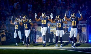 “WAY OUT OF BOUNDS” is the way the St. Louis Police Officers Association characterized five St. Louis Rams who entered the dome last Sunday displaying the “hands up, don’t shoot” gesture. Players from left to right: wide receivers Stedman Bailey and Tavon Austin, tight-end Jared Cook, and wide receivers Chris Givens and Kenny Britt.  – Jeff Curry/USA Today photo 