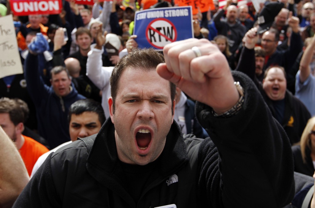 Rob Parsons, a steelworker from Merrillville, Ind., screams during a union workers protest on the steps of the Statehouse after the Senate voted to pass the right-to-work bill in Indianapolis, Wednesday, Feb. 1, 2012. The governor is expected to sign the bill later in the day.  (AP Photo/Michael Conroy)
