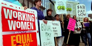 'Equal Pay Day 2000' Rally in front of the U.S Mint, 300 W. Colfax Ave. , Several womens groups speak out about the current wage gap for women and people of colora . smone where carrying red purses to show that women's pay is still in the red, compared to men's pay. Photo is of ( center left ) Nancy Rinker President of Colorado Business & Professional Womens , with other women's groups . Women in Colorado will join with thousands of women in all 50 States in a national call for for action on fair pay -- over four months into the new year-- when women's earnings, on average , finally cach up to men's paychecks from 1999. (Photo By Glen Martin/The Denver Post via Getty Images)