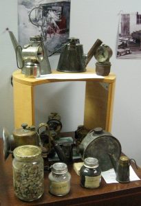 WHAT THEY WORE: The museum has an extensive display of the headlamps that were dangerous but essential equipment for miners. – Labor Tribune photo 
