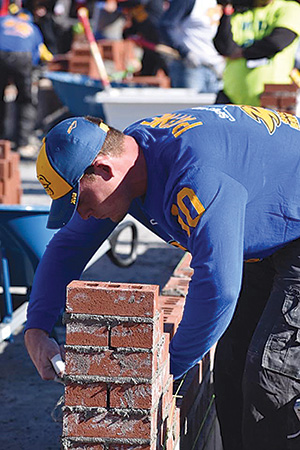Bricklayers Are Building As A Team Stock Photo - Download Image Now - iStock